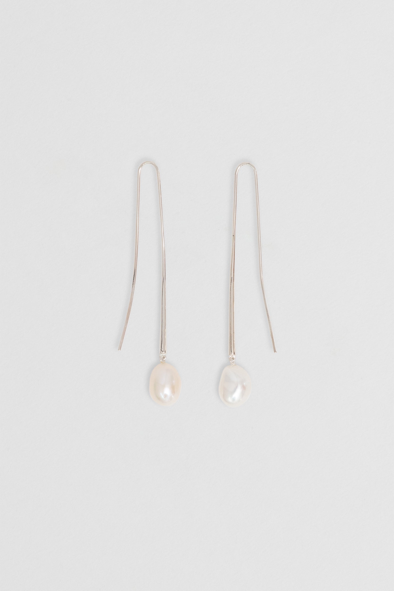 Ethically sourced Baroque pearl earrings, 73mm length, in recycled sterling silver design