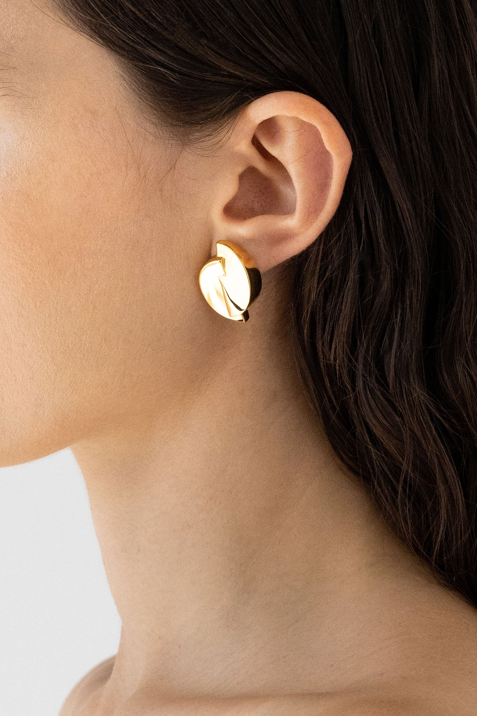 Model's side profile displaying 1989 Dome Earrings in 14k gold vermeil