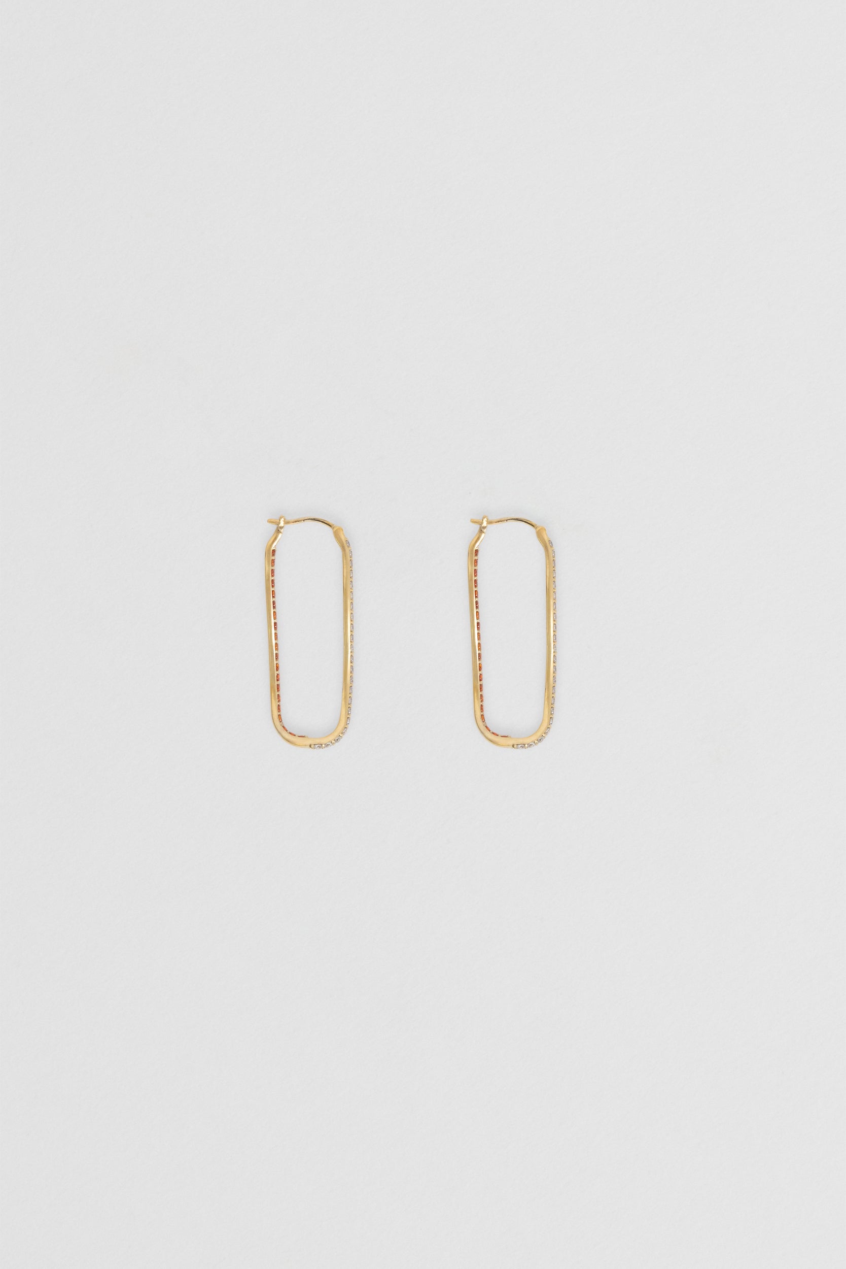 Close-up of 35mm tangerine hoops with clear & orange cubic zirconia gemstones