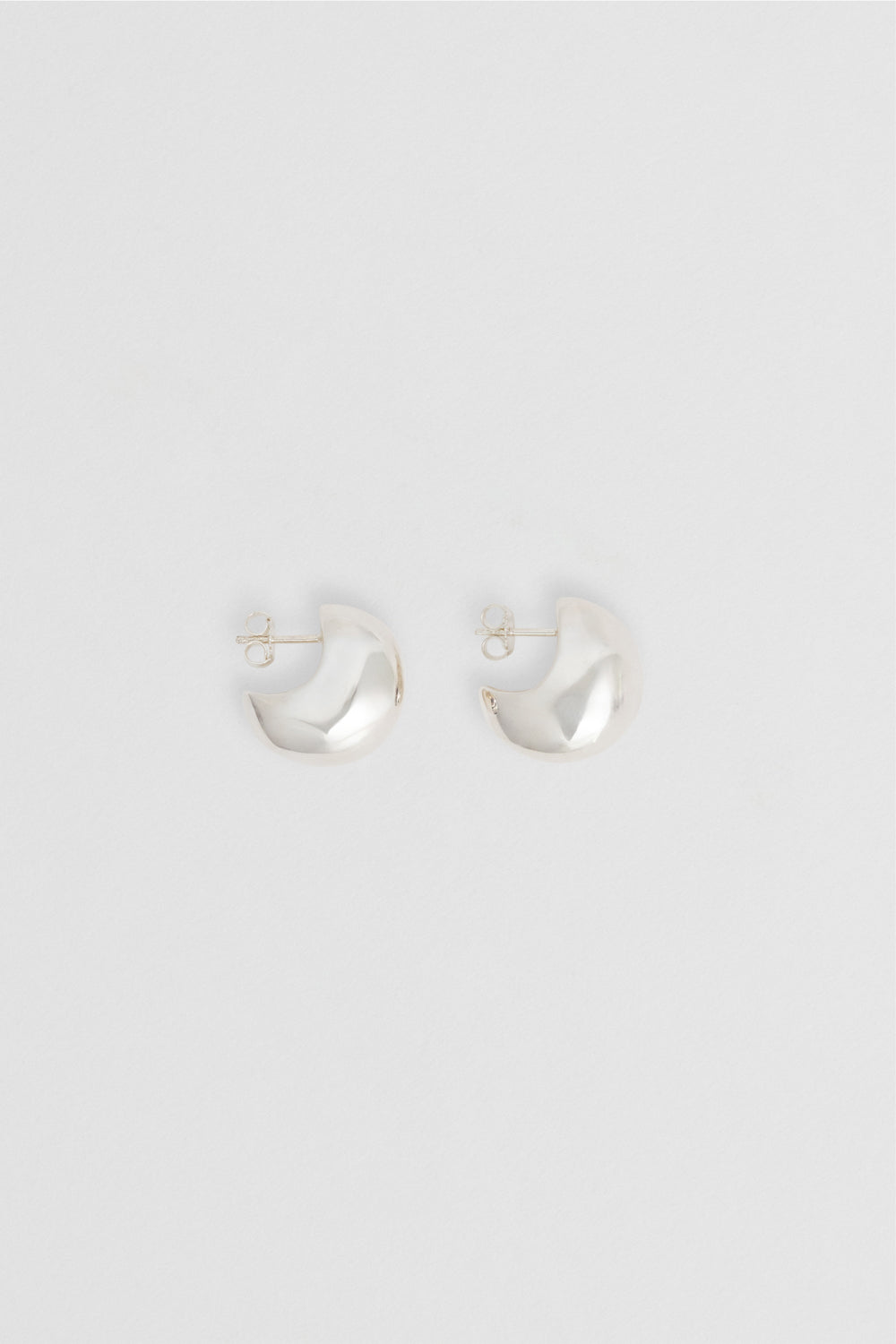 Close-up of Figure Hoops Silver, 20mm dome hoops, hollow design in recycled sterling silver