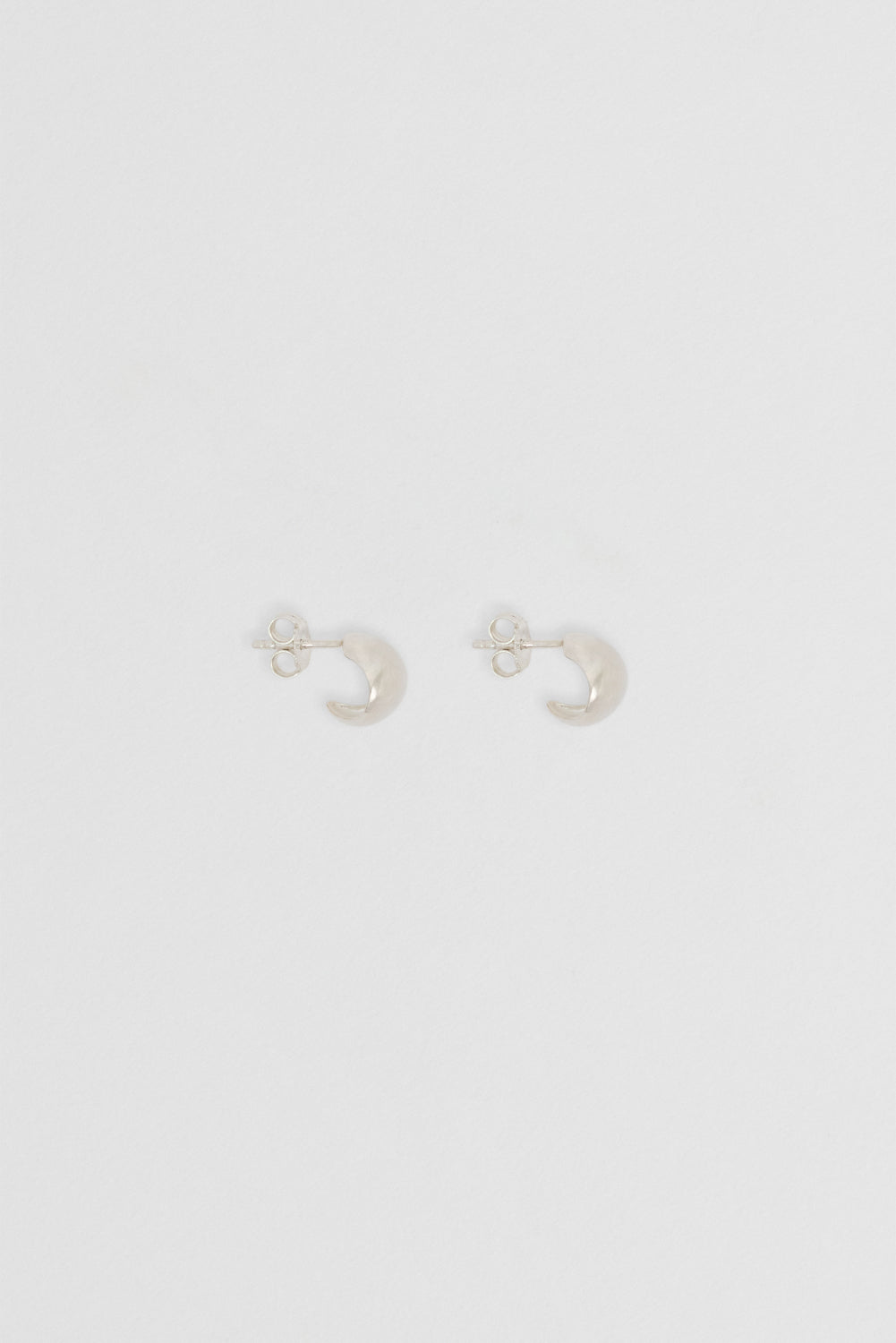 Small Silver Fold Hoops: Minimalist hoops designed to enhance any outfit.