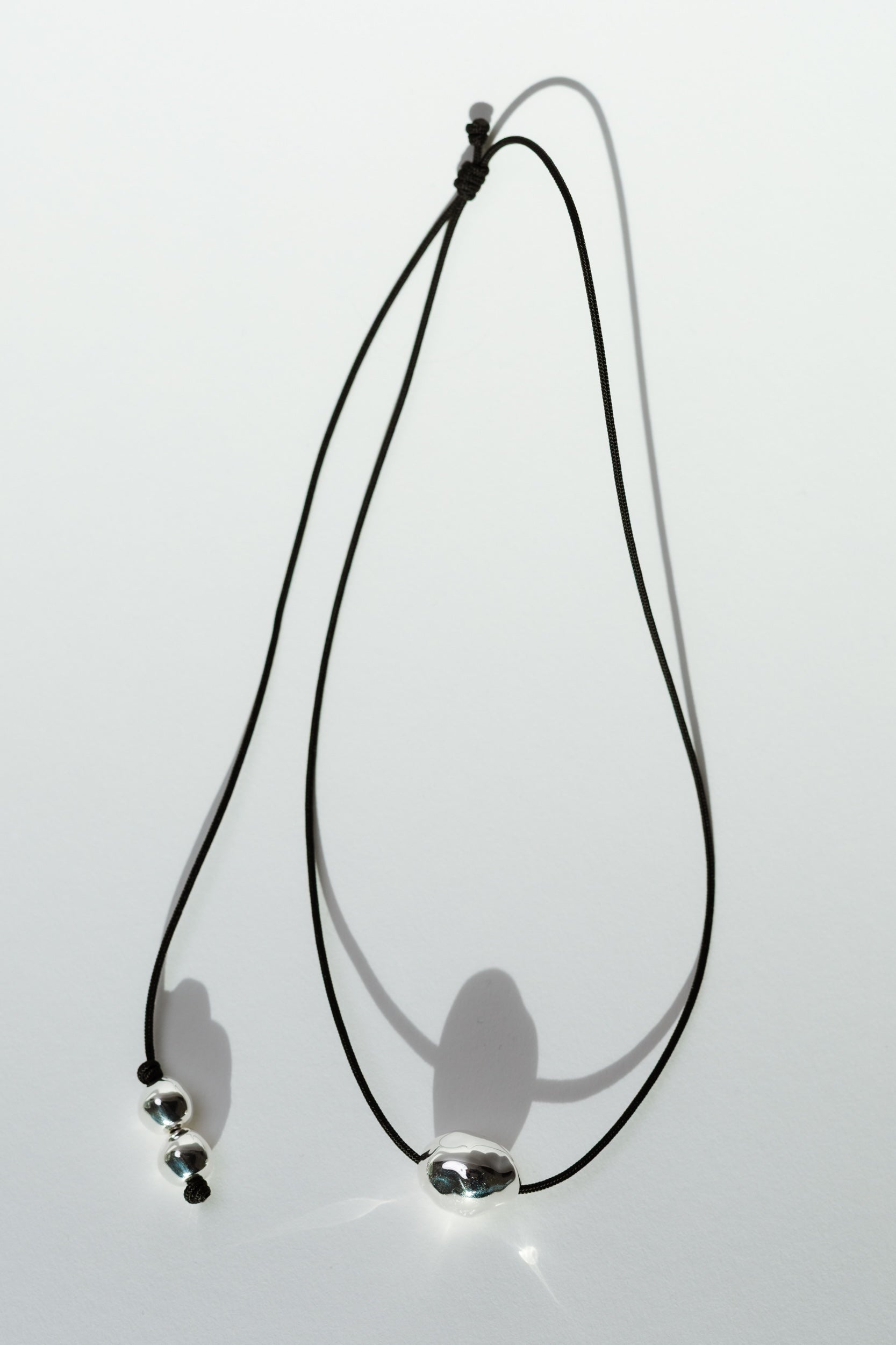 Figure Cord Necklace - Silver