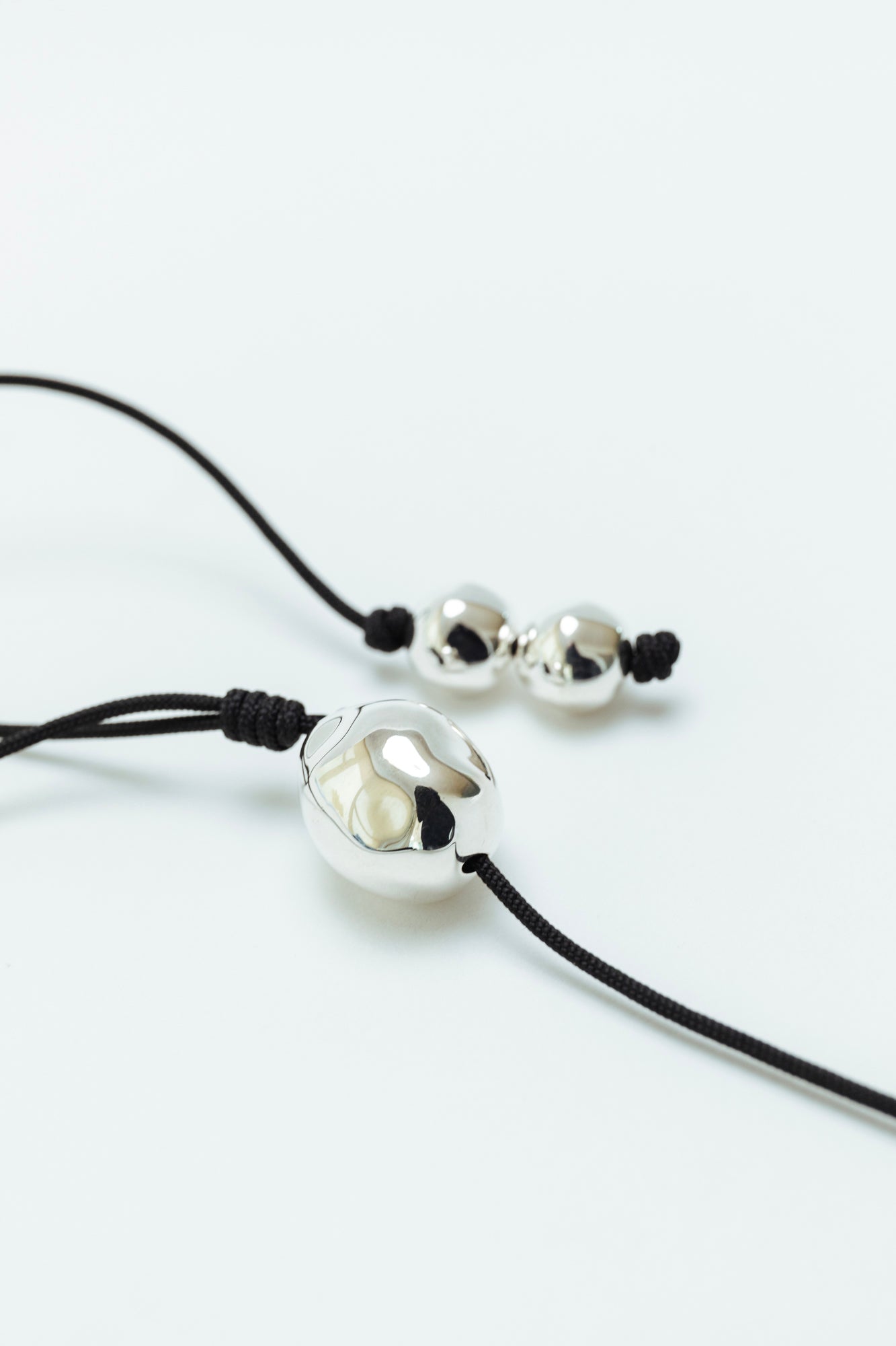 Figure Cord Necklace - Silver